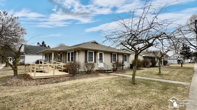 single story home featuring a front yard