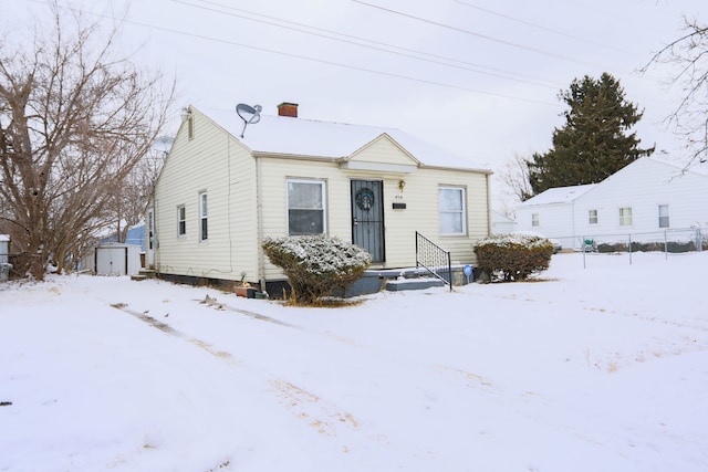 view of front of house featuring a storage shed