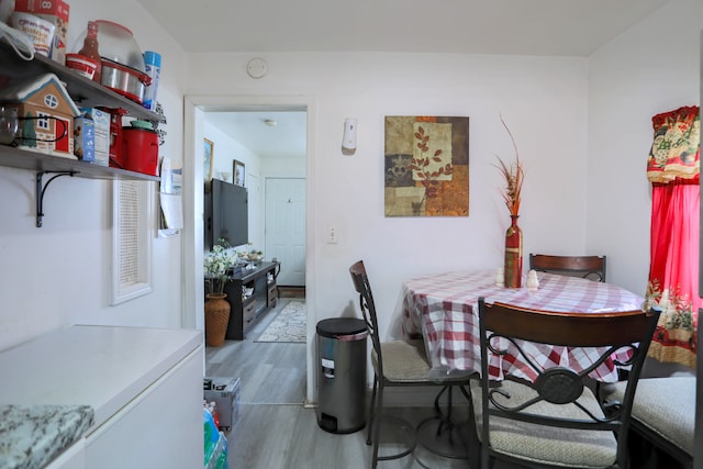 dining space featuring hardwood / wood-style floors