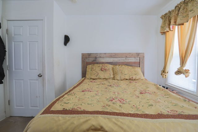 bedroom featuring multiple windows