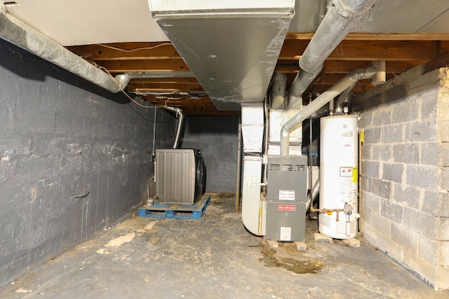 basement featuring heating unit and gas water heater