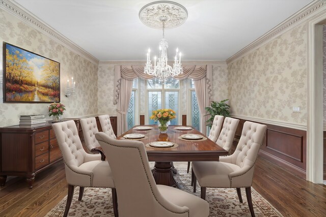 dining room with wallpapered walls, crown molding, a wainscoted wall, an inviting chandelier, and wood finished floors