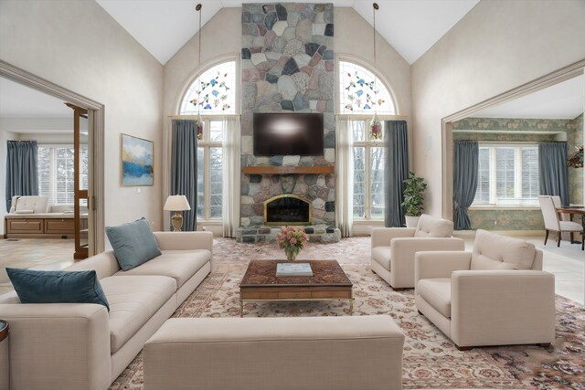 living area featuring high vaulted ceiling and a fireplace