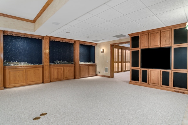 unfurnished living room with visible vents, light colored carpet, and ornamental molding