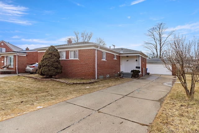 single story home with a garage, an outdoor structure, and a front yard