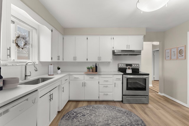 kitchen featuring electric stove, sink, light hardwood / wood-style flooring, white cabinetry, and white dishwasher