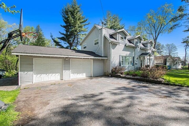 view of side of property with a garage