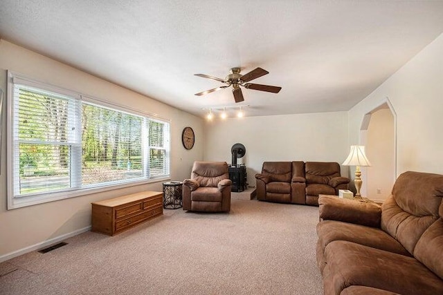 living room with carpet floors and ceiling fan