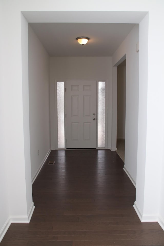 foyer featuring dark hardwood / wood-style floors