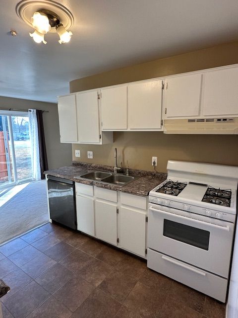 kitchen with sink, white cabinetry, white range with gas cooktop, dishwasher, and dark carpet