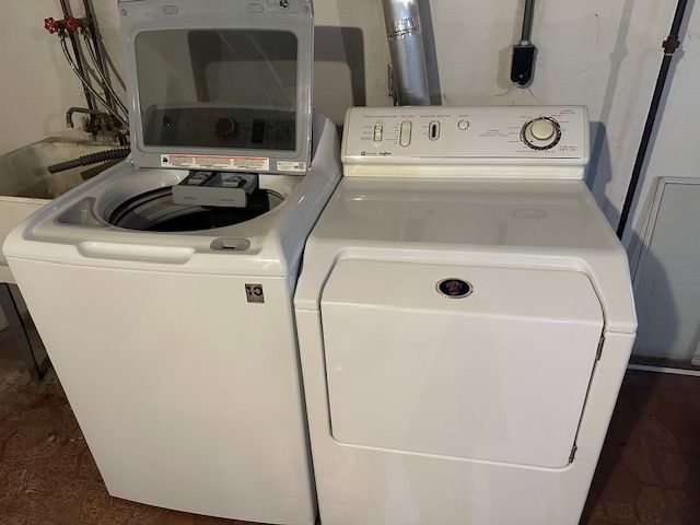 laundry room with separate washer and dryer