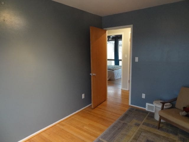 living area with hardwood / wood-style floors