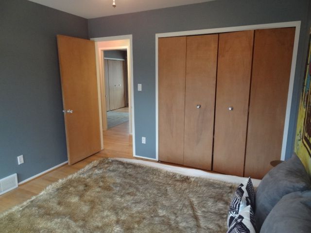 unfurnished bedroom featuring a closet and light wood-type flooring