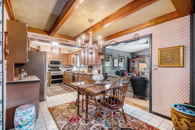 tiled dining room featuring sink, a notable chandelier, and beamed ceiling