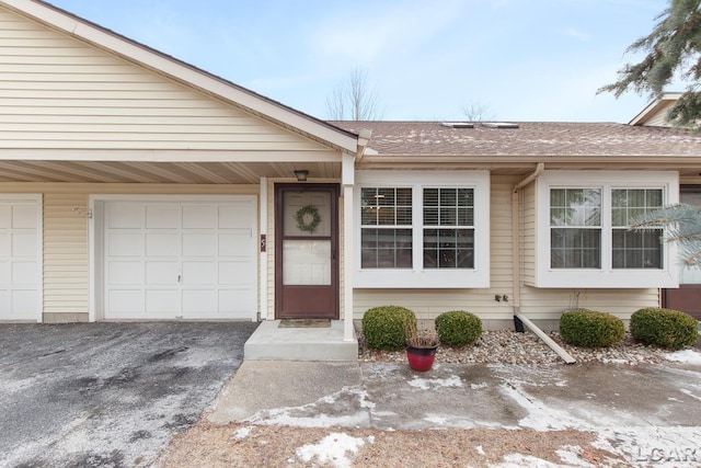 property entrance with a garage