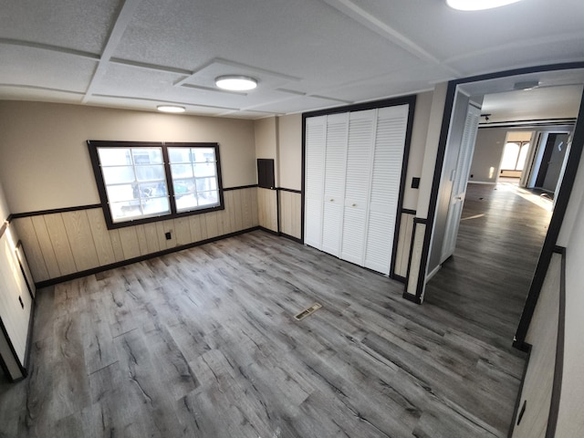 unfurnished bedroom with hardwood / wood-style floors