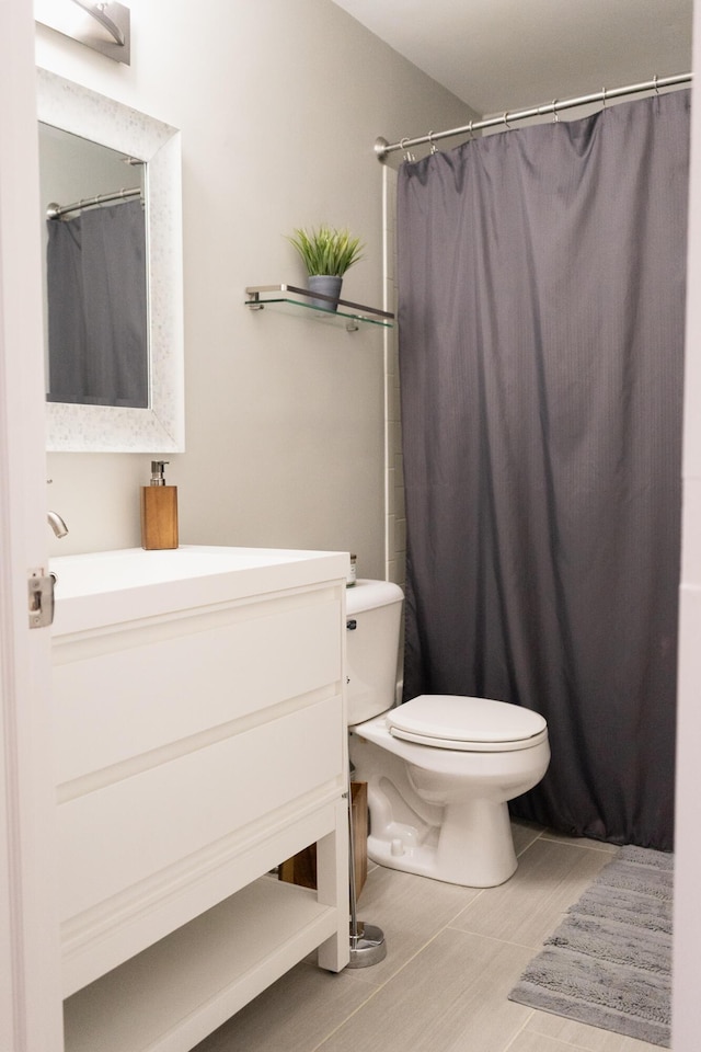 bathroom with vanity, a shower with curtain, and toilet