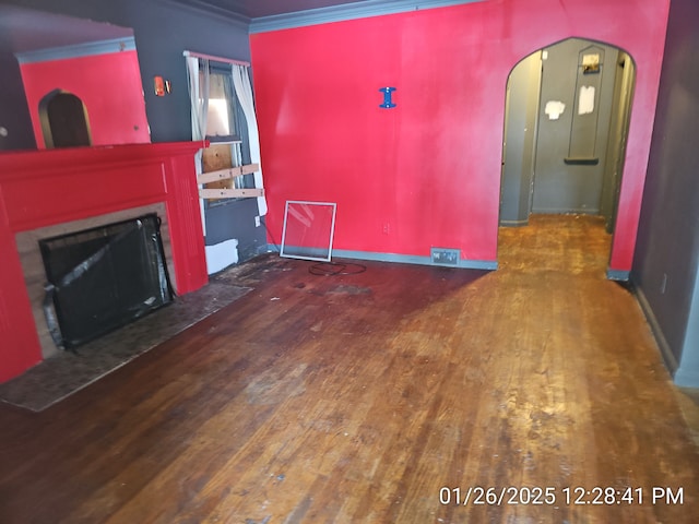 living room featuring crown molding and dark hardwood / wood-style flooring