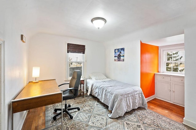 bedroom with wood-type flooring