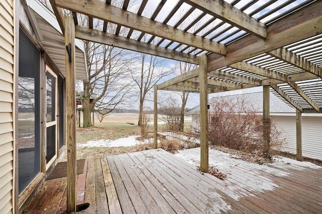 snow covered deck featuring a pergola