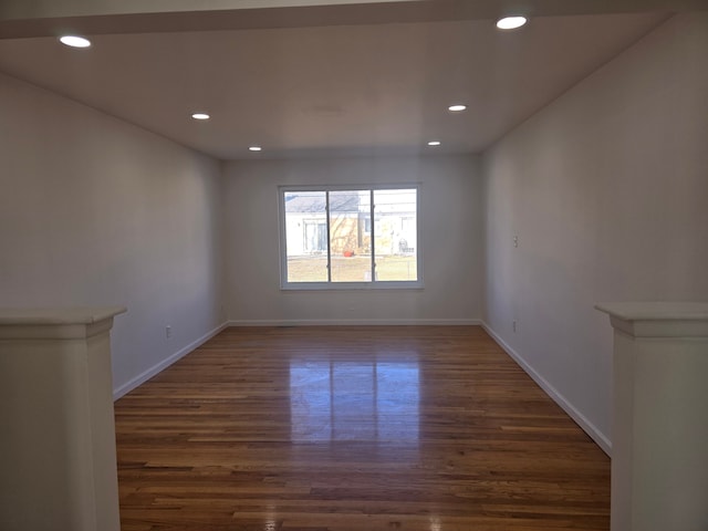 empty room with dark wood-type flooring