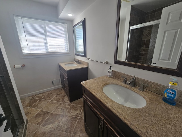 bathroom with vanity and walk in shower