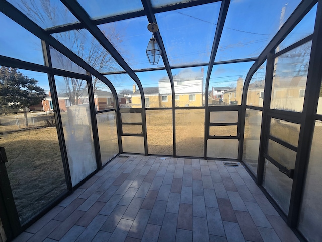 unfurnished sunroom featuring a healthy amount of sunlight