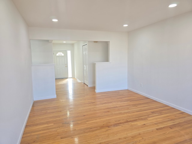 empty room with light hardwood / wood-style floors