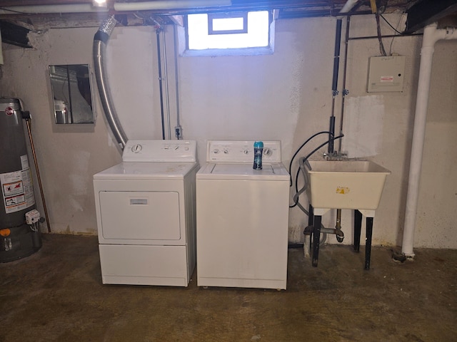 clothes washing area featuring gas water heater, sink, and washer and clothes dryer