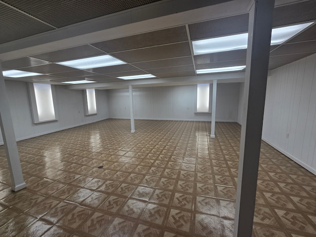 basement featuring a drop ceiling