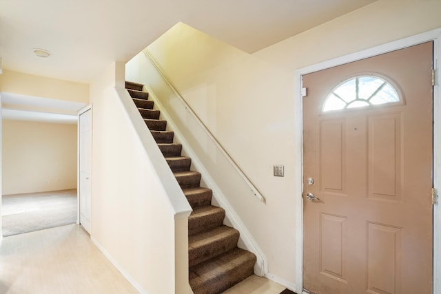 26889 Farmbrook Villa Dr, Southfield, MI 48034 - foyer entrance with stairway and light carpet
