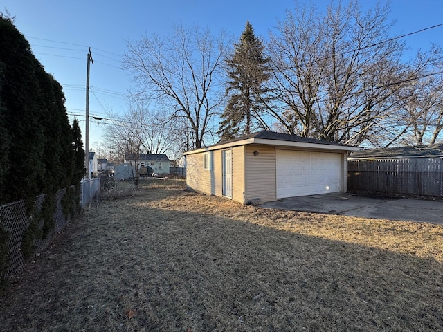 garage featuring a lawn