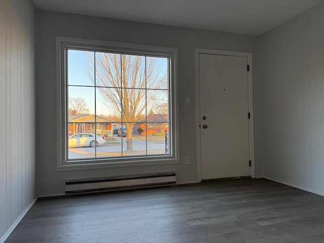 interior space with baseboard heating and light hardwood / wood-style flooring