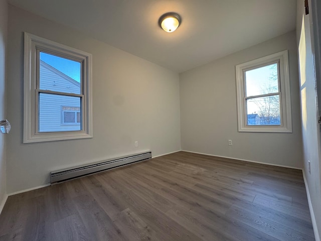 bonus room featuring hardwood / wood-style floors and baseboard heating