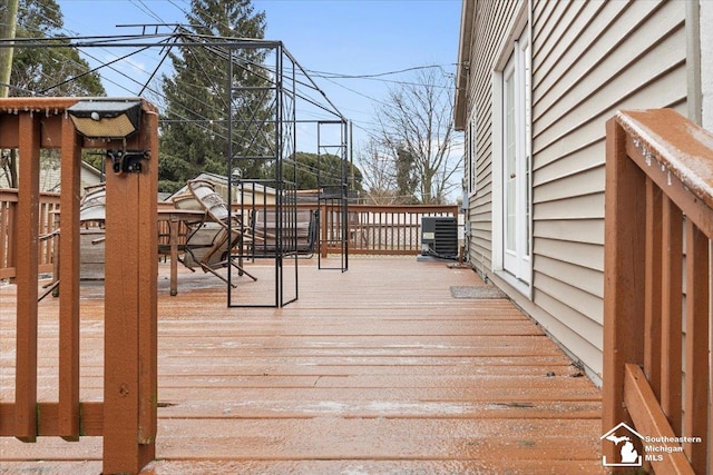 wooden terrace featuring central AC unit