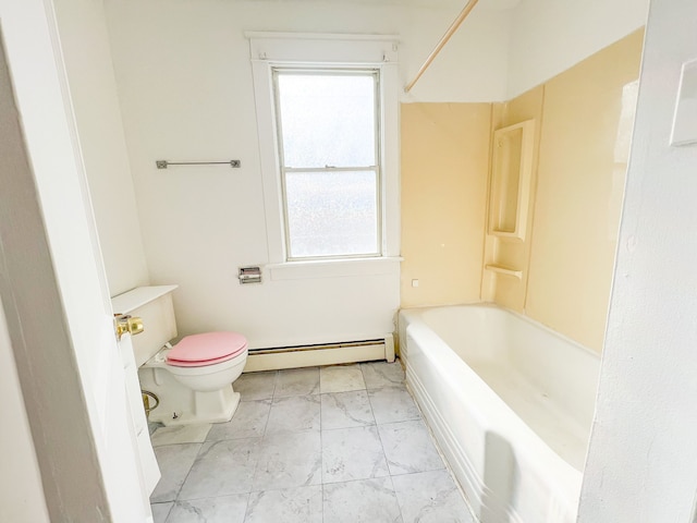 bathroom with baseboard heating and toilet