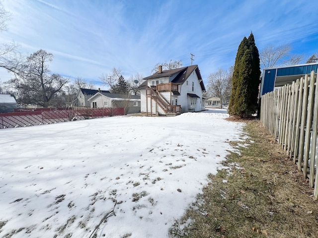 view of yard covered in snow