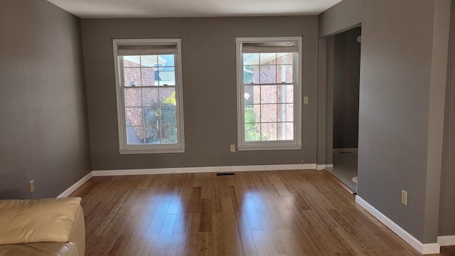 unfurnished room featuring light hardwood / wood-style floors