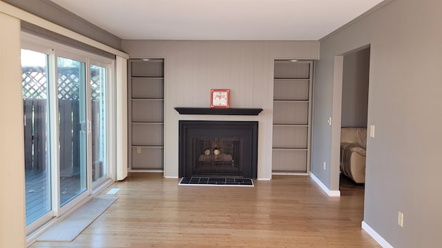 unfurnished living room with light hardwood / wood-style floors