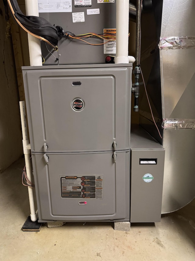 utility room with heating unit