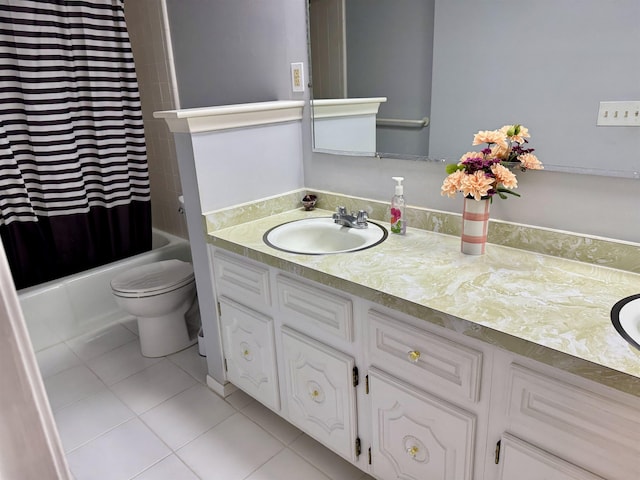 full bathroom featuring tile patterned floors, vanity, toilet, and shower / tub combo