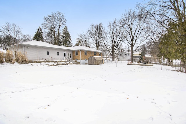 view of snow covered property