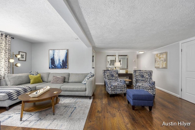 living room with dark hardwood / wood-style flooring and a textured ceiling