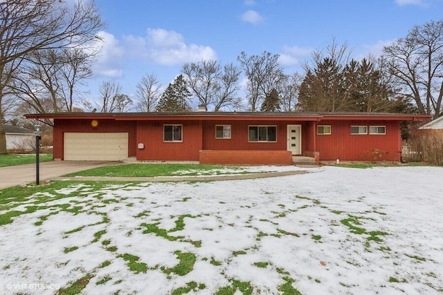 ranch-style home featuring a garage