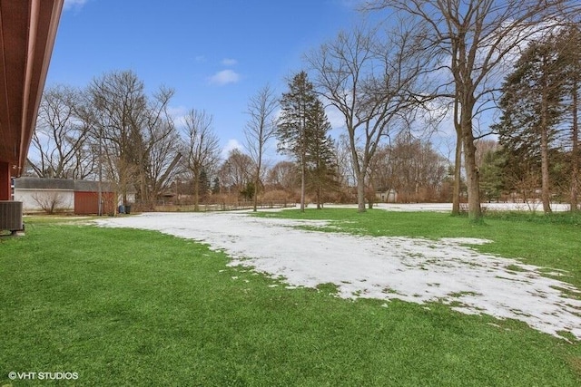 snowy yard with central AC