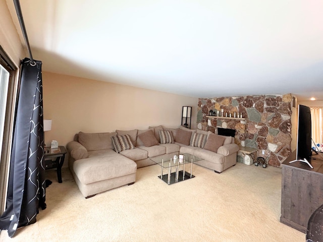 carpeted living room with a fireplace