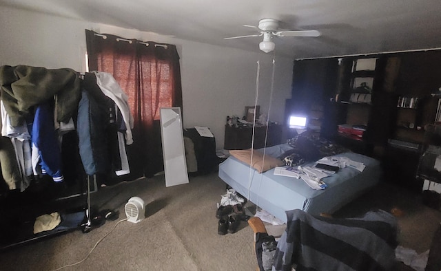 bedroom with ceiling fan and carpet