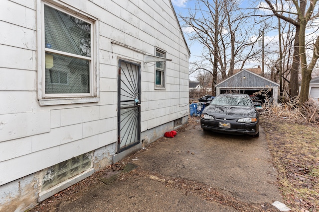 view of side of home featuring an outbuilding