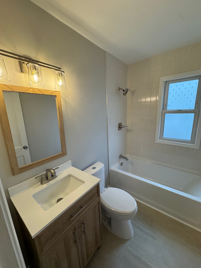 full bathroom with vanity, toilet, and tiled shower / bath combo