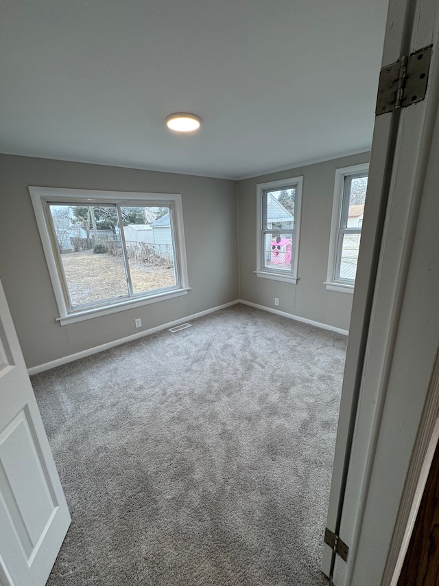 empty room featuring carpet floors